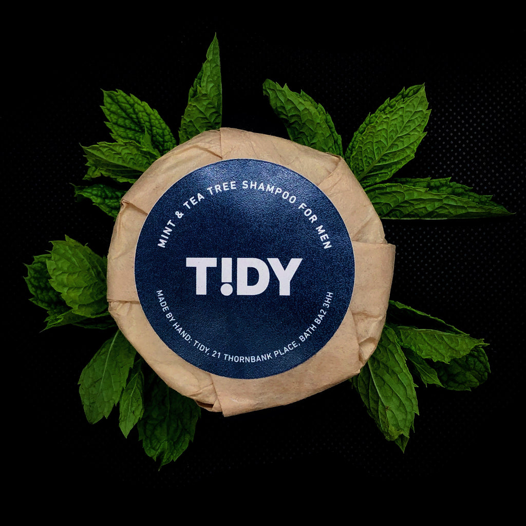 Tidy solid shampoo bar for men in compostable wrapper